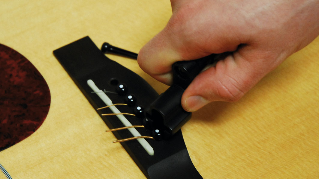 Guitar Setup How To Remove Bridge Pins On An Acoustic Guitar Musicradar