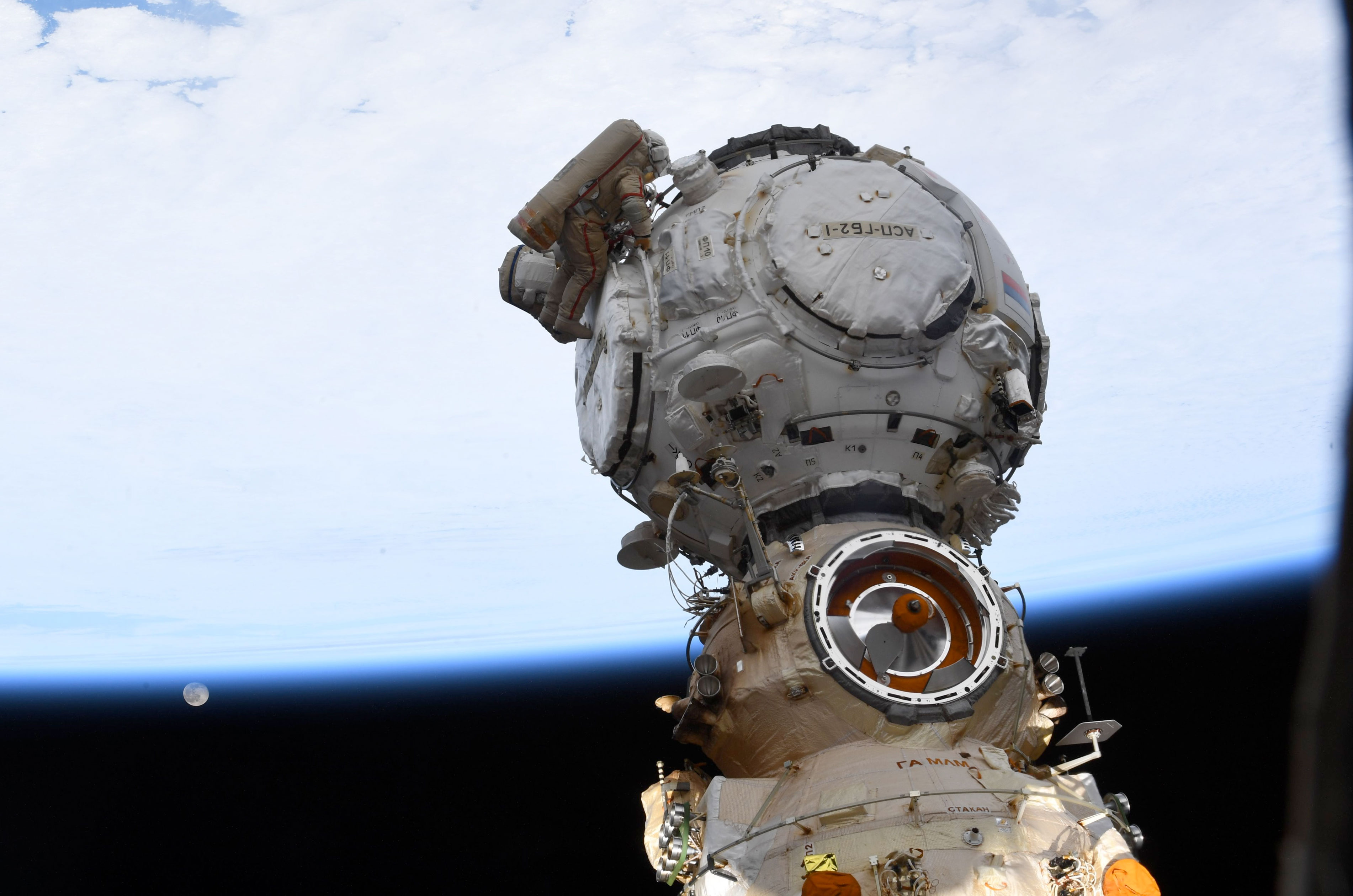 Cosmonauts on spacewalk ready new Russian docking port for future space station arrivals thumbnail