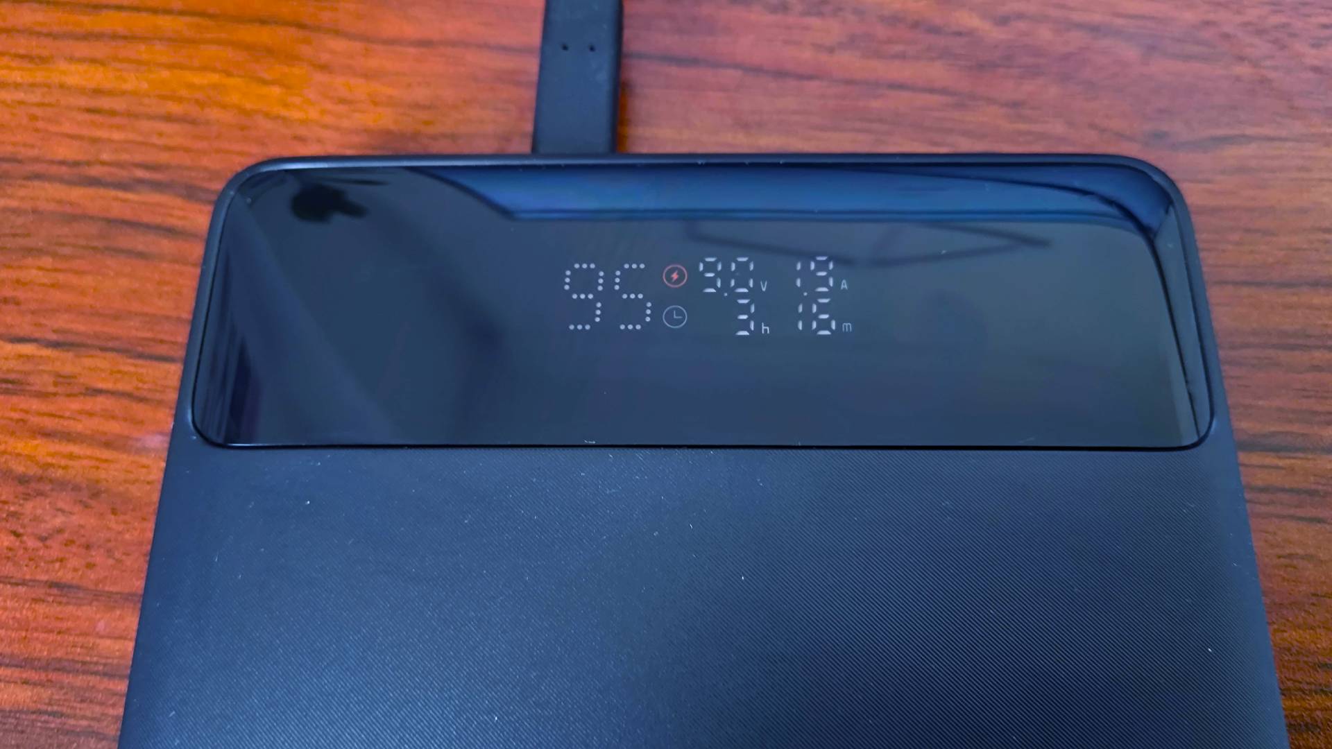 Baseus Blade Power Bank with capacity and power stats on screen.