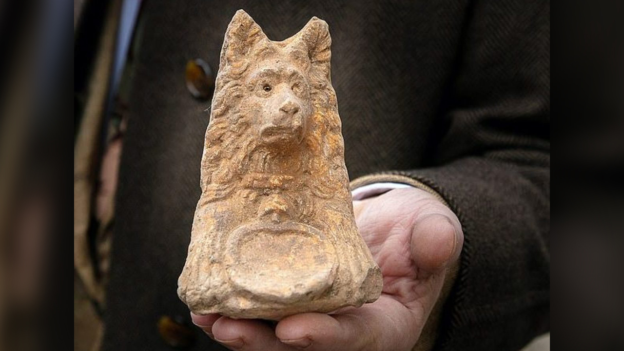 Ancient dog-headed statue found during Roman road excavation thumbnail