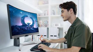 A man uses one of the best ultrawide monitors