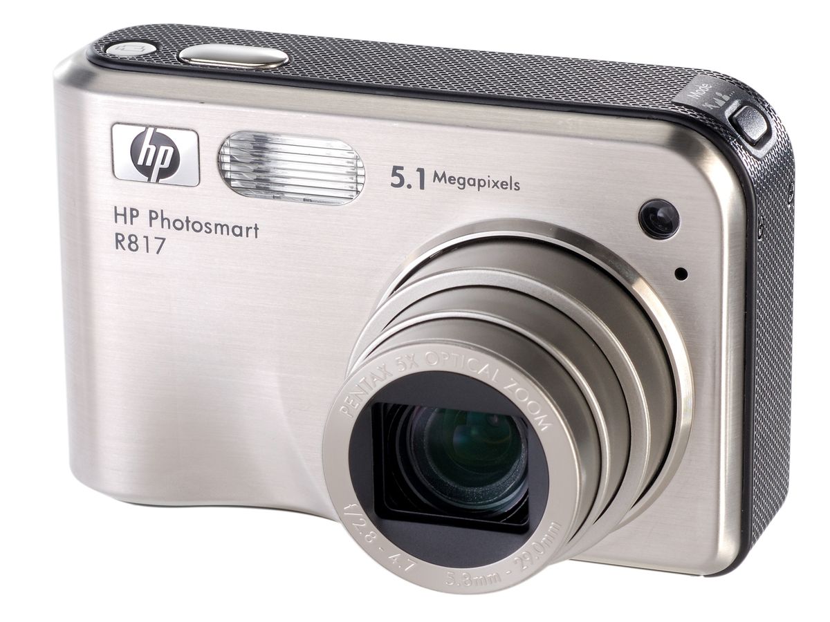  A silver HP Photosmart R817 digital camera with a 5.1 megapixel camera.