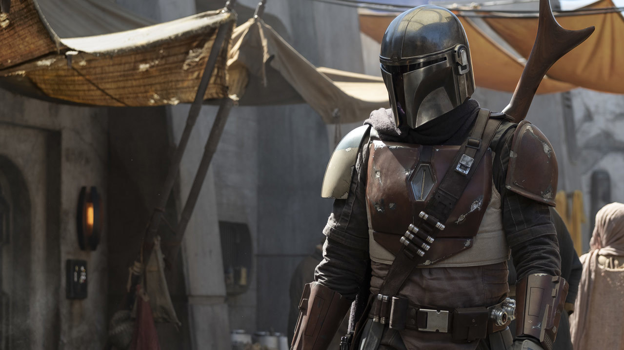 The first image from the Star Wars live action show The Mandalorian, showing a person wearing Mandalorian armor