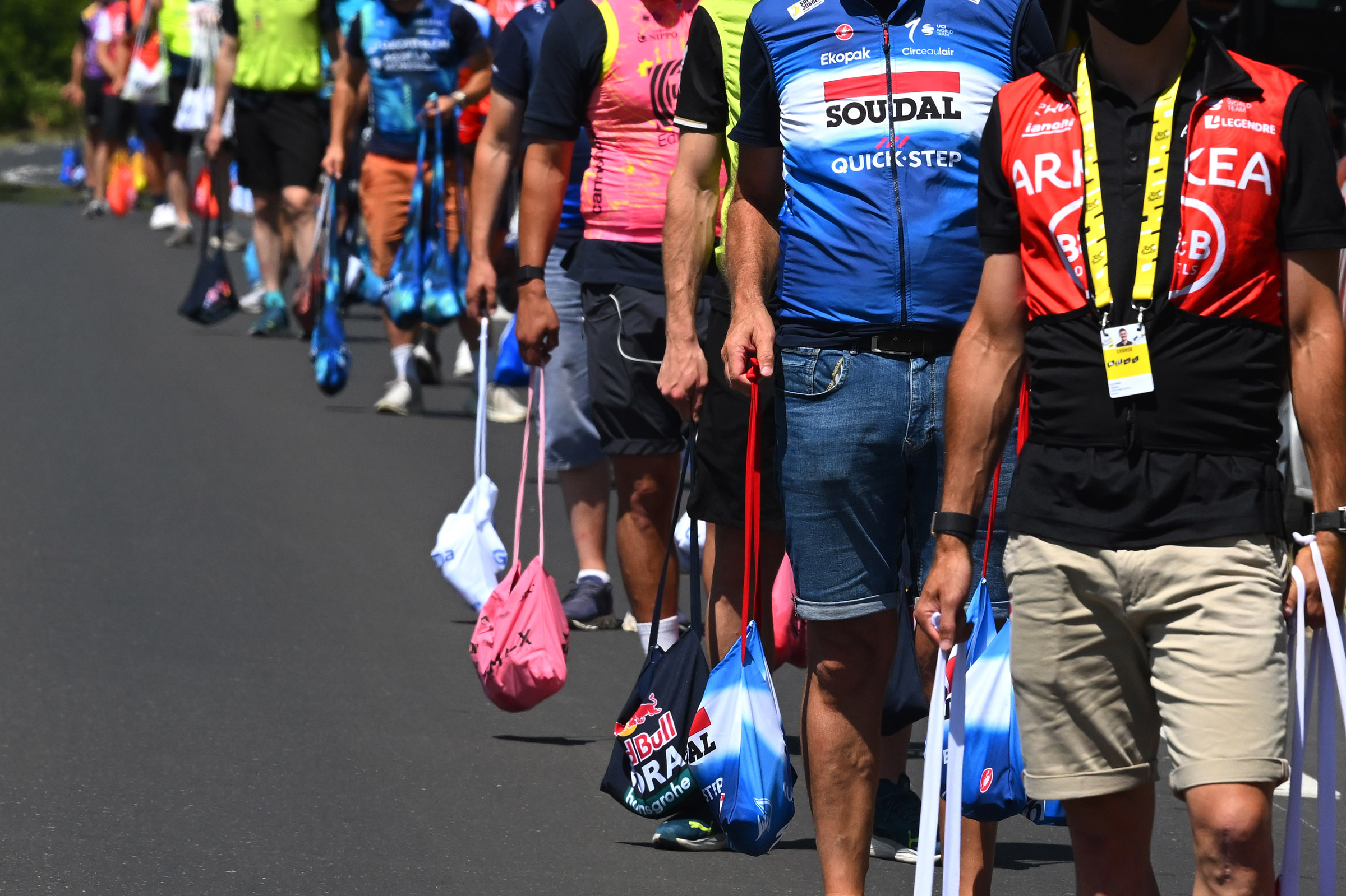 NIMES, FRANCE - JULY 16: (EDITOR'S NOTE: Alternate crop) Team soigneurs at the feed zone during the 111th Tour de France 2024, Stage 16 a 188.6km stage from Gruissan to Nimes / #UCIWT / on July 16, 2024 in Nimes, France. (Photo by Dario Belingheri/Getty Images)
