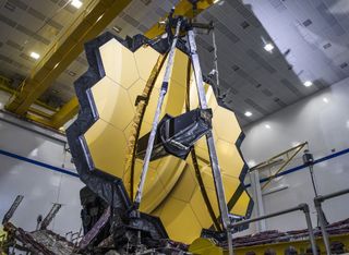 NASA's James Webb Space Telescope has successfully deployed its giant primary mirror, putting the new observatory one big step closer to being ready for launch in 2021. The entire 256-inch (6.5 meters) primary mirror assembly unfurled into the same configuration that it would be after deploying in space. This critical test took place in early March 2020, right before NASA's centers shut down due to the coronavirus pandemic. Work on the Webb telescope was temporarily halted on March 20. 