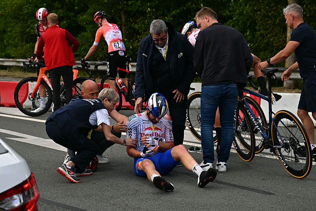Red Bull - BORA - Hansgrohe team's Belgian rider Jordi Meeus receives medical assistance after being involved in a crash in the final kilometres before the finish of the 3rd stage of the 112th edition of the Tour de France cycling race, 178.3 km between Valenciennes and Dunkerque (Dunkirk), Northern France, on July 7, 2025. (Photo by Loic VENANCE / AFP) (Photo by LOIC VENANCE/AFP via Getty Images)
