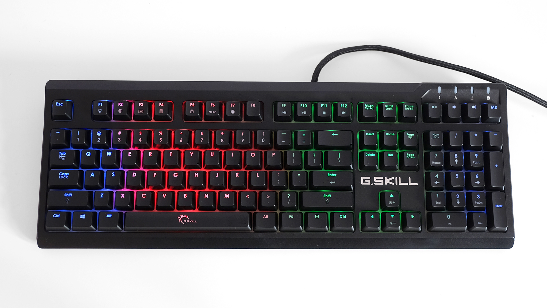 A photo of the G.Skill Ripjaws KM570 RGB lit up