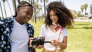 best camera for YouTube: Man and woman using Nikon Z30