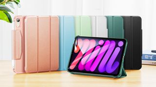 The best iPad Mini 6 cases as shown by a variation of cases in different colours on a desk