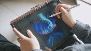 A person shows how to draw on the iPad