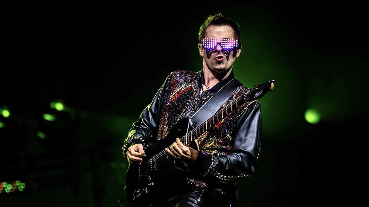 Matt Bellamy channels his inner Thanos with a wearable robot glove synth during Muse’s Isle of Wight headline set thumbnail