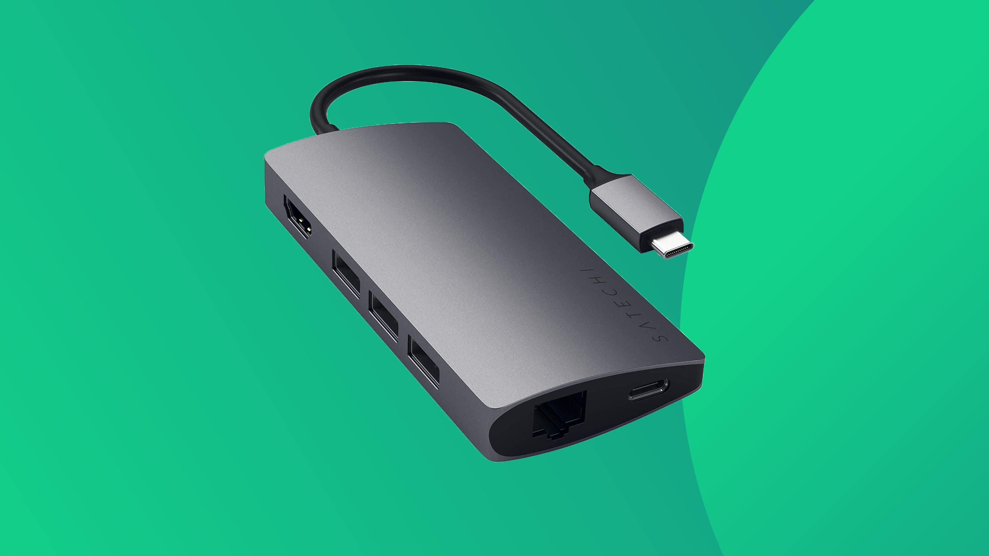 A product shot of the Satechi Multi-port adaptor V2 on a green background