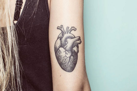 Nano's hand poked heart tattoo