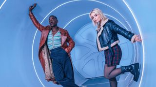 Ncuti Gatwa and Millie Gibson pose inside a sci-fi tunnel for Doctor Who