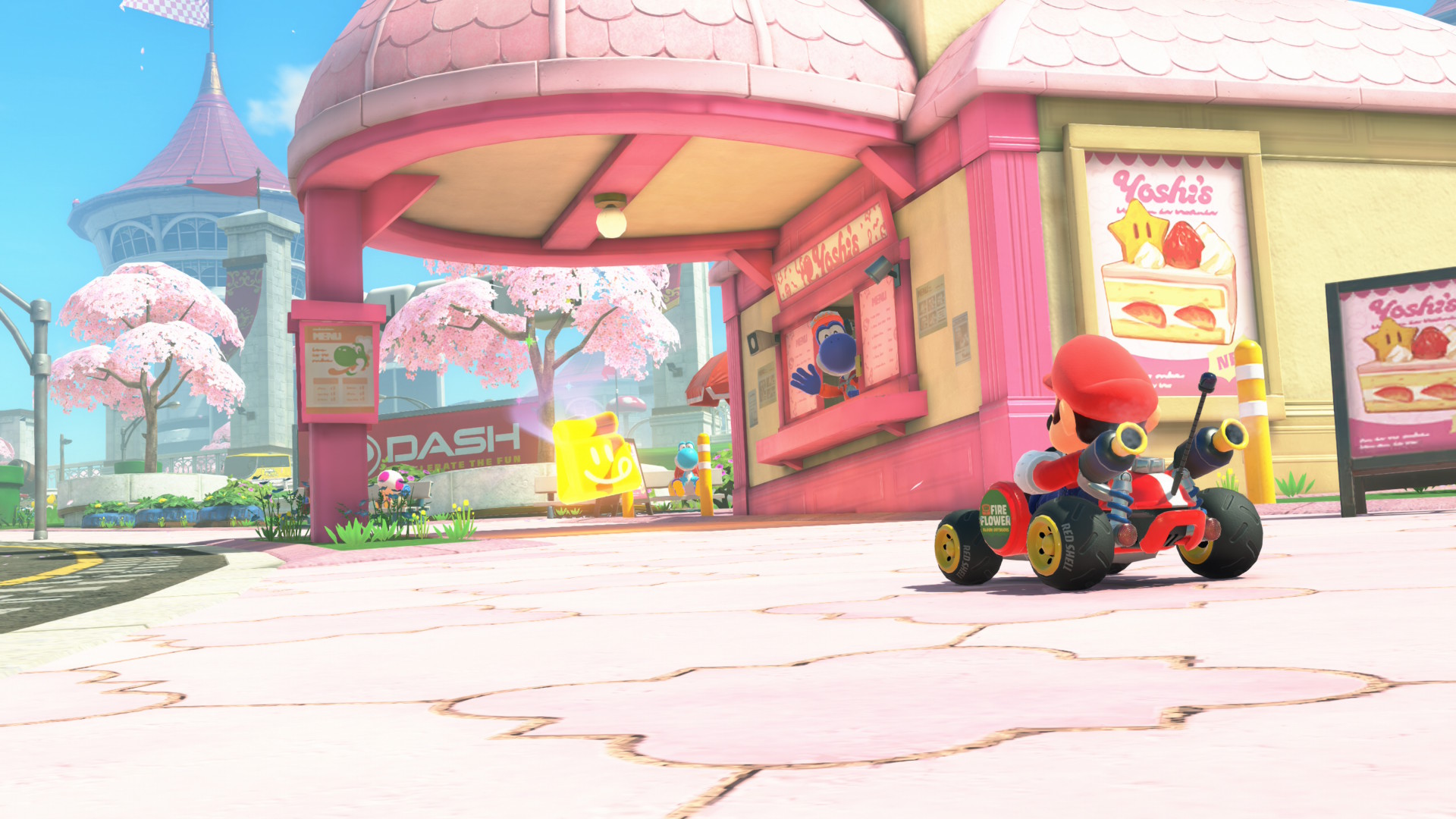 Mario driving up to a Yoshi Cafe in Mario Kart World