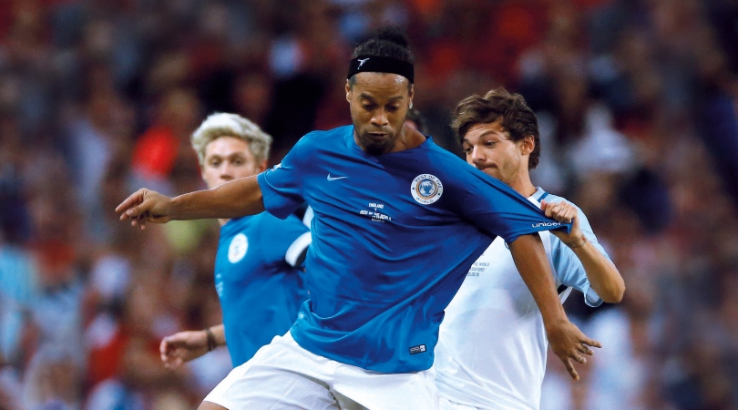 Louis Tomlinson recalls the time Ronaldinho tried to nutmeg him: 'There’s a sick picture’ thumbnail