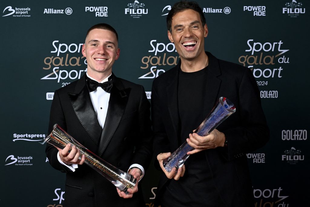 Belgian cyclist Remco Evenepoel (L) and Belgian cycling coach and former professional cyclo-cross racing cyclist Sven Vanthourenhout hold their awards during the &#039;Gala du Sport 2024&#039;, to announce the sportswomen and sportsmen of the Year 2024, at the Skyhall de Brussels Airport, in Zaventem on January 12, 2025. (Photo by DIRK WAEM / Belga / AFP) / Belgium OUT