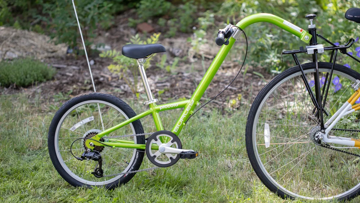 Burley 7 Speed Piccolo Kid's Trailer Cycle outside on the grass