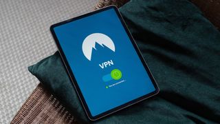 iPad lying on sofa with screen showing VPN connection: how to set up an iPad VPN