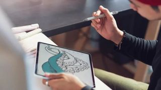 The best Apple Pencil alternatives include this Logitech Crayon, being used by an artist on an iPad