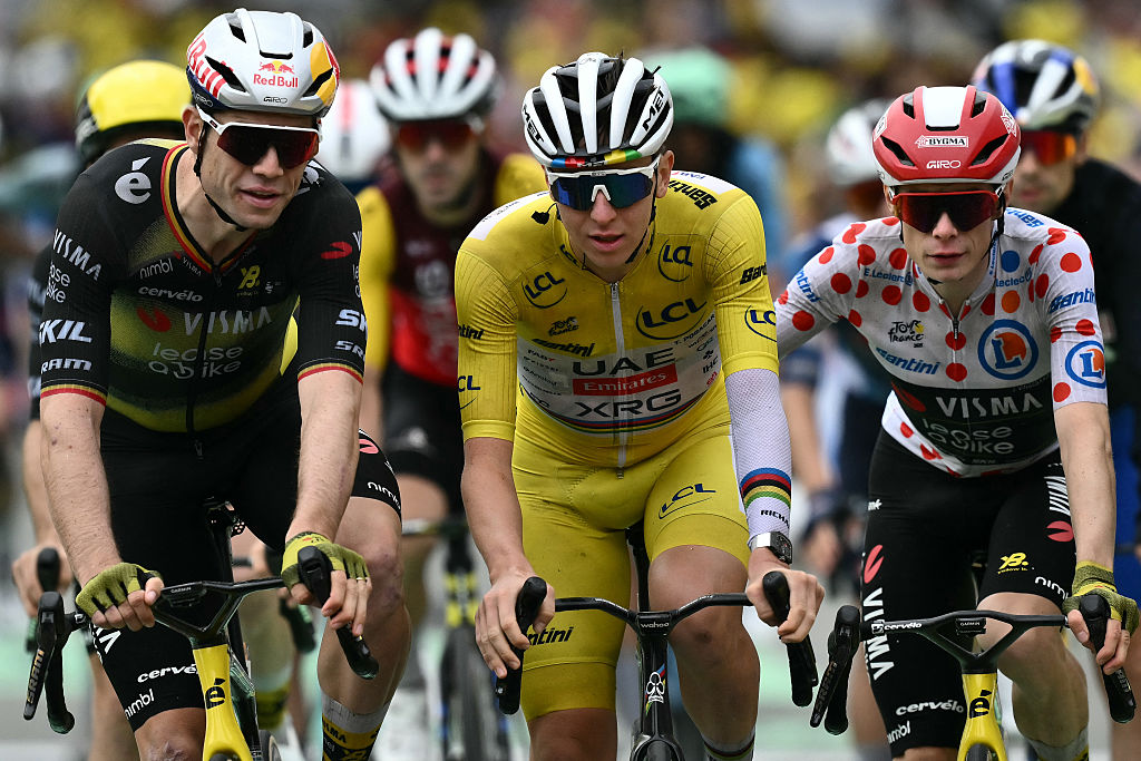 Team Visma - Lease a bike team's Belgian rider Wout van Aert (L), UAE Team Emirates - XRG team's Slovenian rider Tadej Pogacar and Team Visma - Lease a bike team's Danish rider Jonas Vingegaard cycle past the finish line of the 20th stage of the 112th edition of the Tour de France cycling race, 184.2 km between Nantua and Pontarlier, in the Jura, eastern France, on July 26, 2025. (Photo by Marco BERTORELLO / AFP)