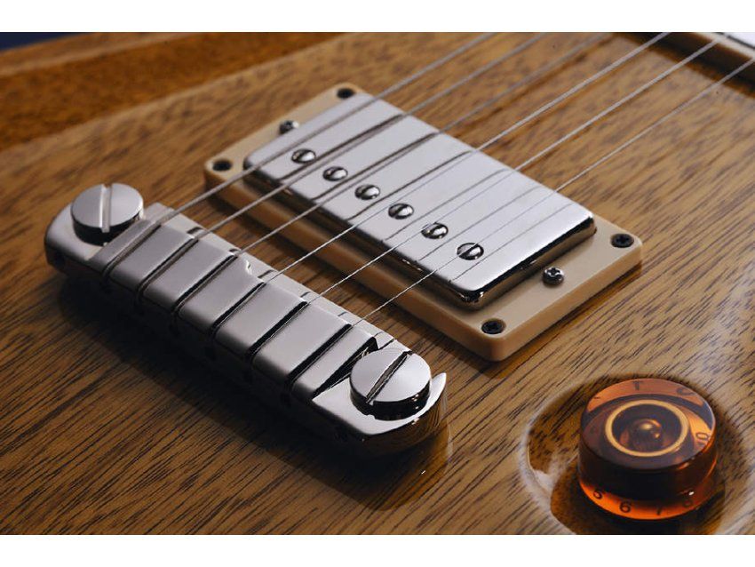 The stop-tail bridge and covered humbuckers are standard PRS fare
