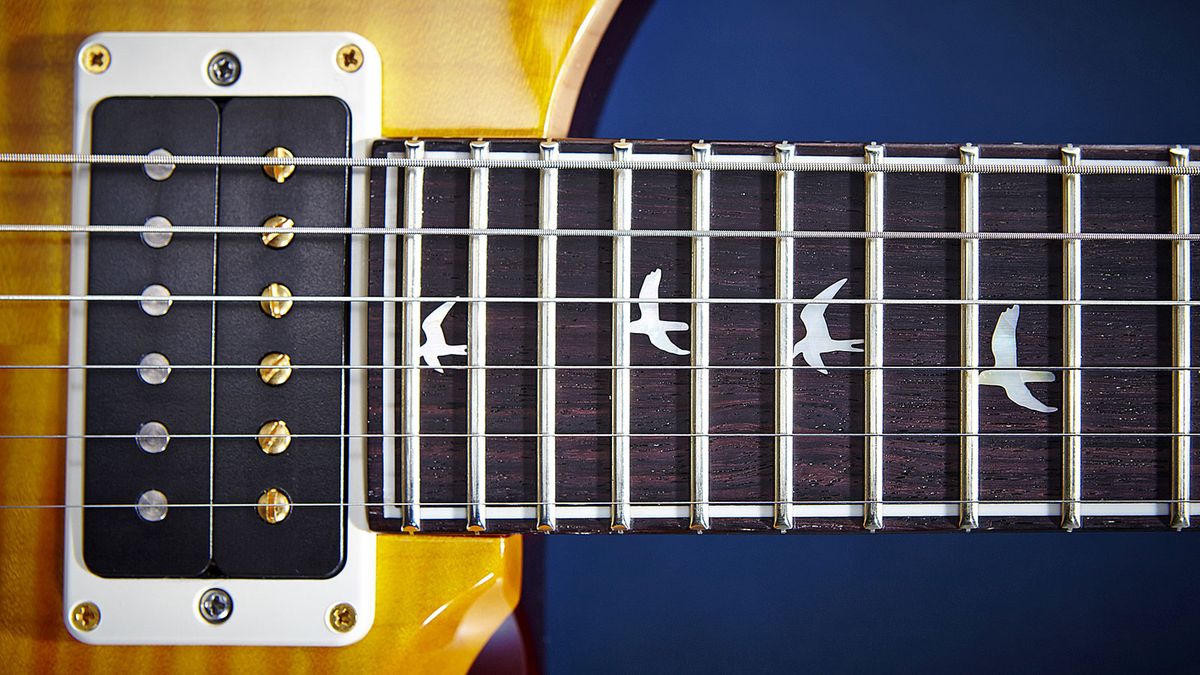 The ubiquitous bird inlays on the one-piece mahogany