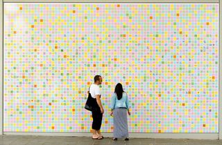 The peace wall started out as a few Post-it notes covering a broken window