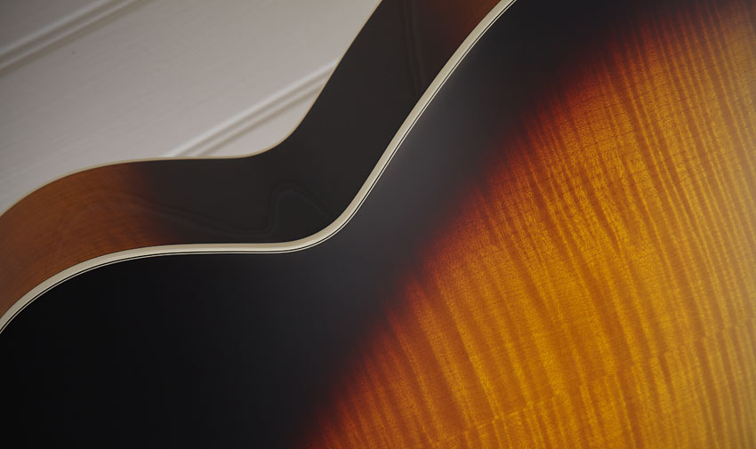 The Series 6 specification goes for solid spruce top with solid flame maple back and laminate flame maple sides