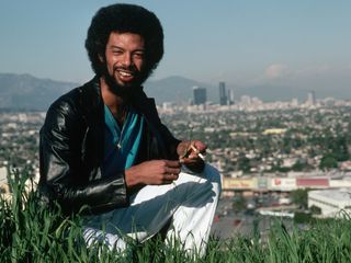 Gil Scott-Heron, relaxing on a patch of grass overlooking Los Angeles, 1980