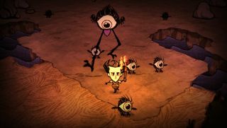 Games like Minecraft - a player running from a monster during Don't Starve.