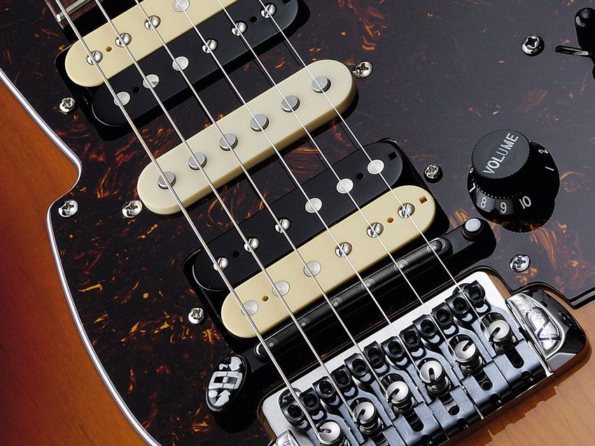 The bridge and hex pickups don't look too incongruous on an ordinary guitar.