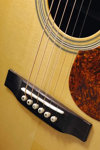 The RD27's rosewood bridge adds to its classy, understated looks.