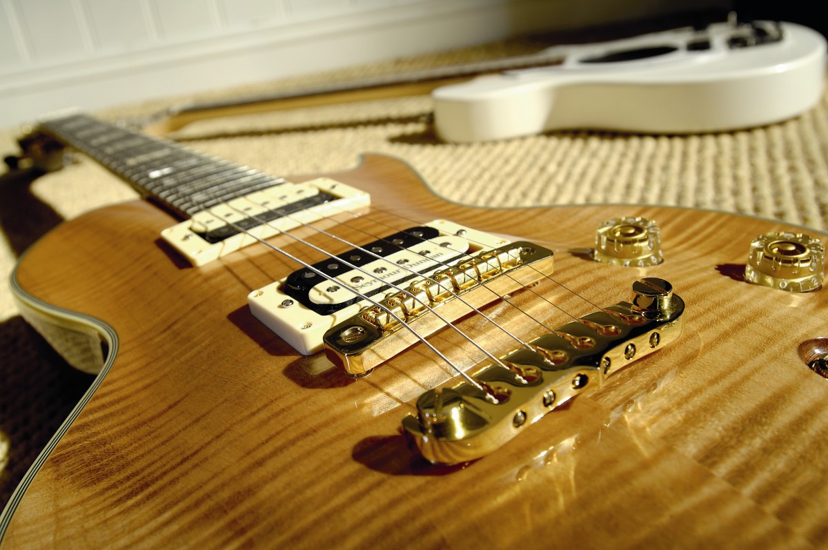 The PE-Inspire's body is thinner and narrower than a Les Paul