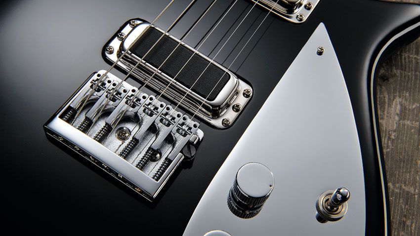 A flat-mount Schaller bridge ensures better tuning stability than vintage Rickys