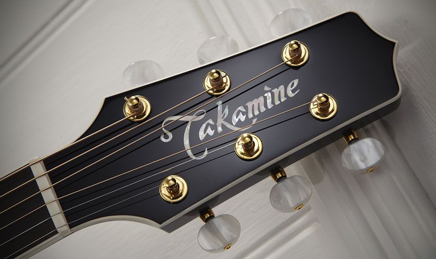 The tuners are gold-plated with pearloid buttons