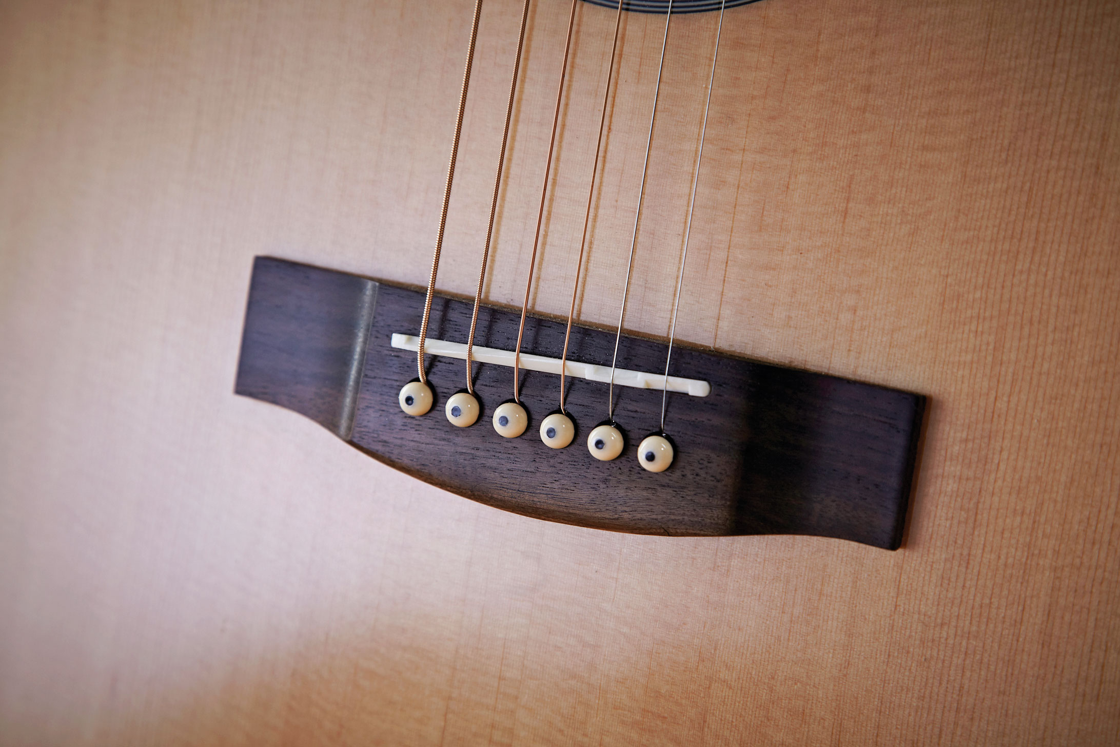 The solid-bone saddle is well shaped and accurately compensated, with surprisingly accommodating string spacing