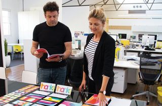 Designworks’ Derek Samuel and Annika Weis look over their rebranding work