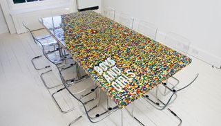 Created in collaboration with abgc architects, the Boys and Girls lego table took 22,742 pieces to build and includes the company's logo in white bricks