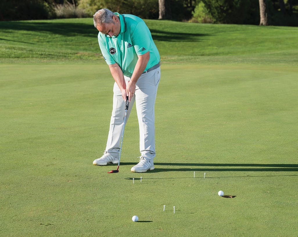 A drill with three gates, each set up three feet from the hole, encouraging the golfer to make them from all sides of the cup