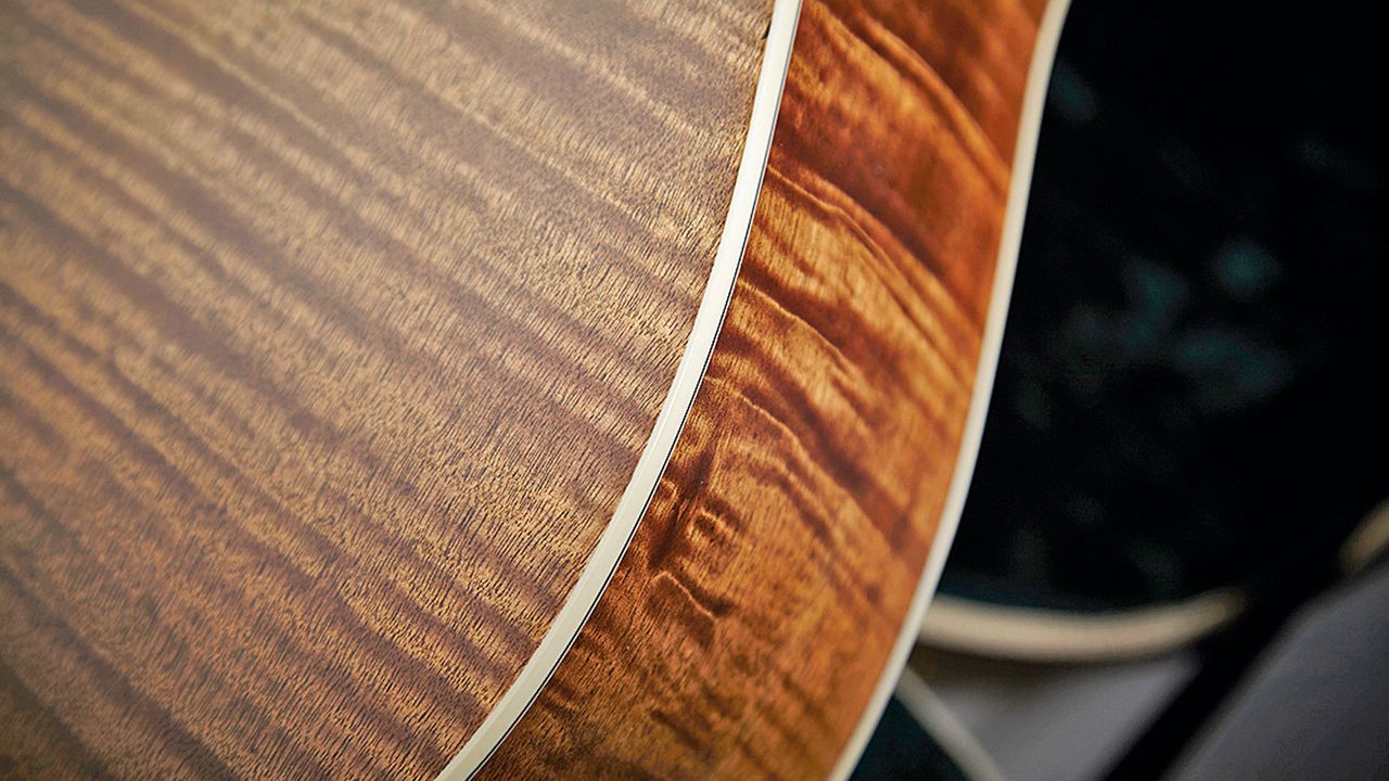 A stunning tiger mahogany veneer is used on the back and sides