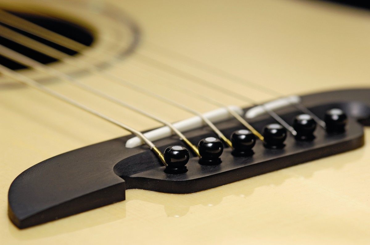 The handlebar moustache-shaped ebony bridge is a distinctive touch
