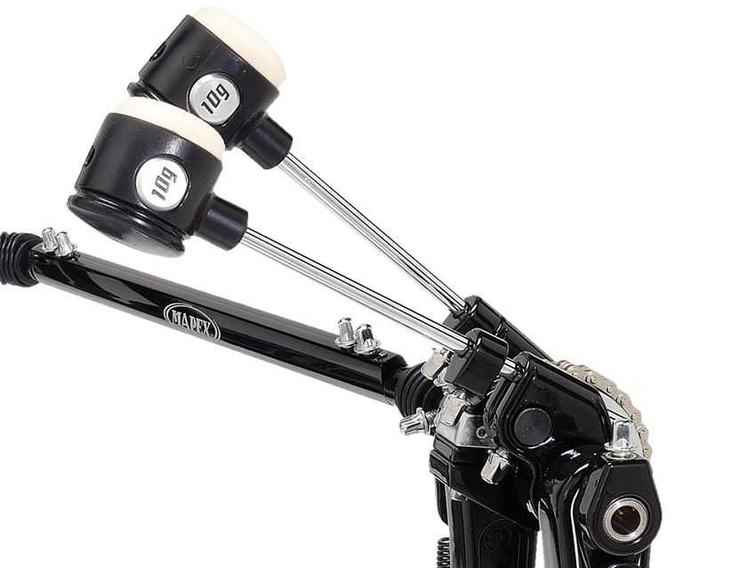 Double beaters are spaced to strike equidistantly from the centre of the head