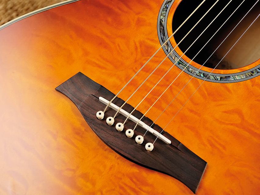 An understated soundhole rosette complements the A300's distinctive finish.