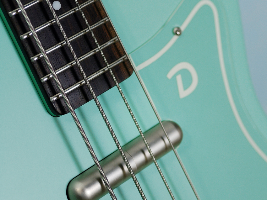 The hardware on the bass is brushed nickel.