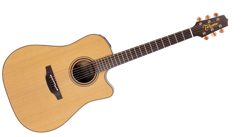 Simple and uncluttered in its design, the solid cedar soundboard bears minimal decoration and no pickguard