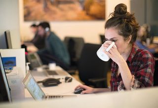 Robin Jones, manager for program compliance, attacks her morning caffeine fix