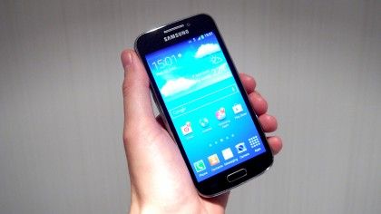 Samsung Galaxy S4 Zoom camera phone in hand