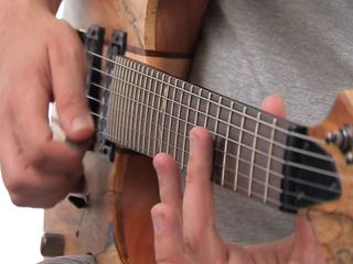 learn how to play natural harmonics using our video, tab and backing track