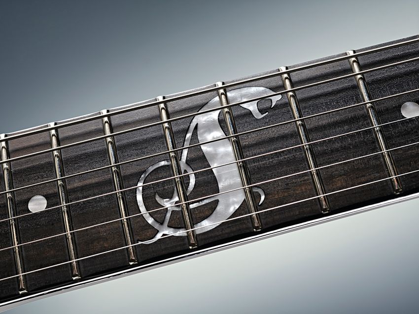 The 12th-fret inlay is rather serpentine.